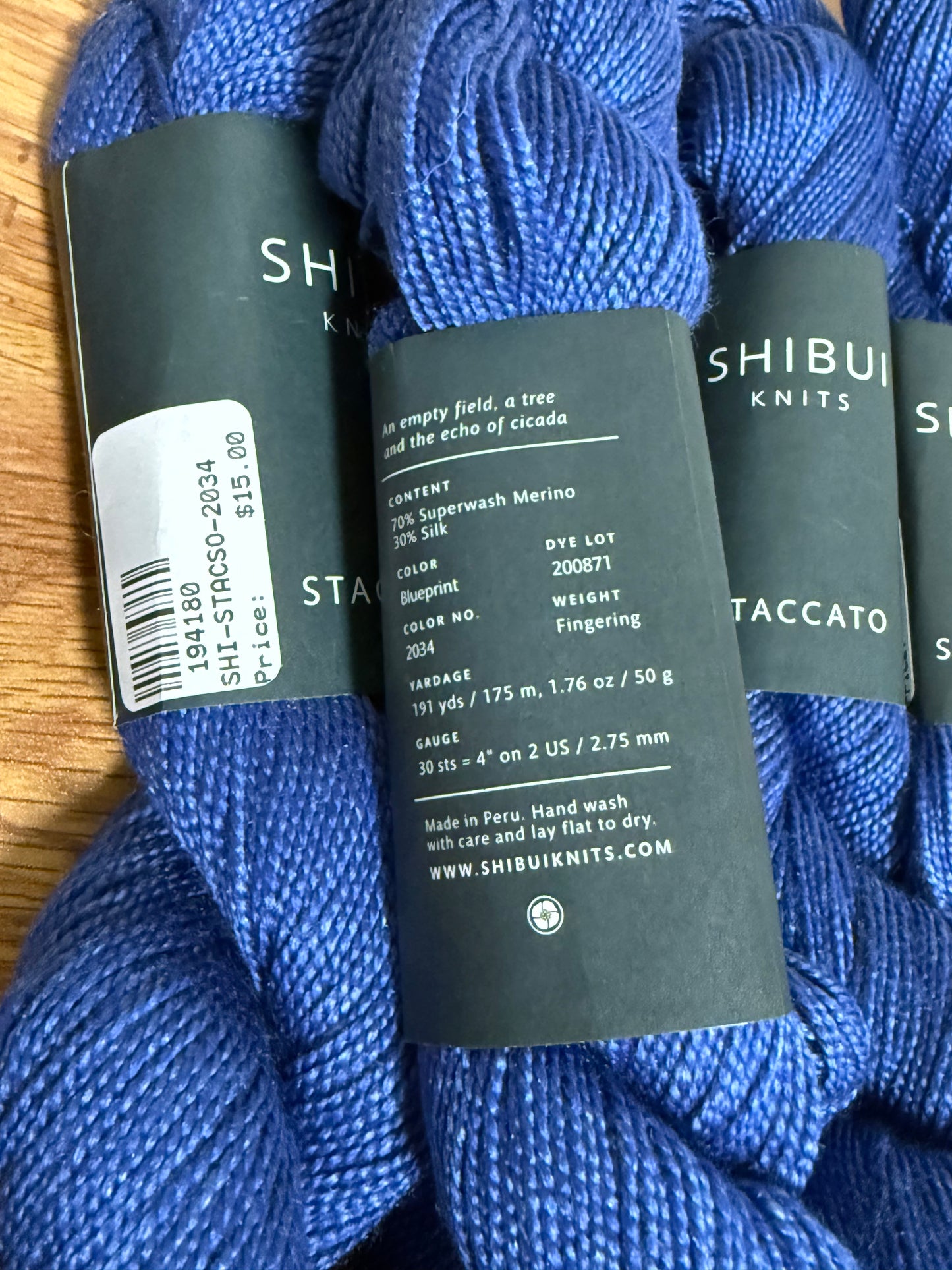 DESTASH: 7 skeins of Shibui Knits Staccato in colorway Blueprint (5x royal blue), Shore (1x light blue), and White (1x)
