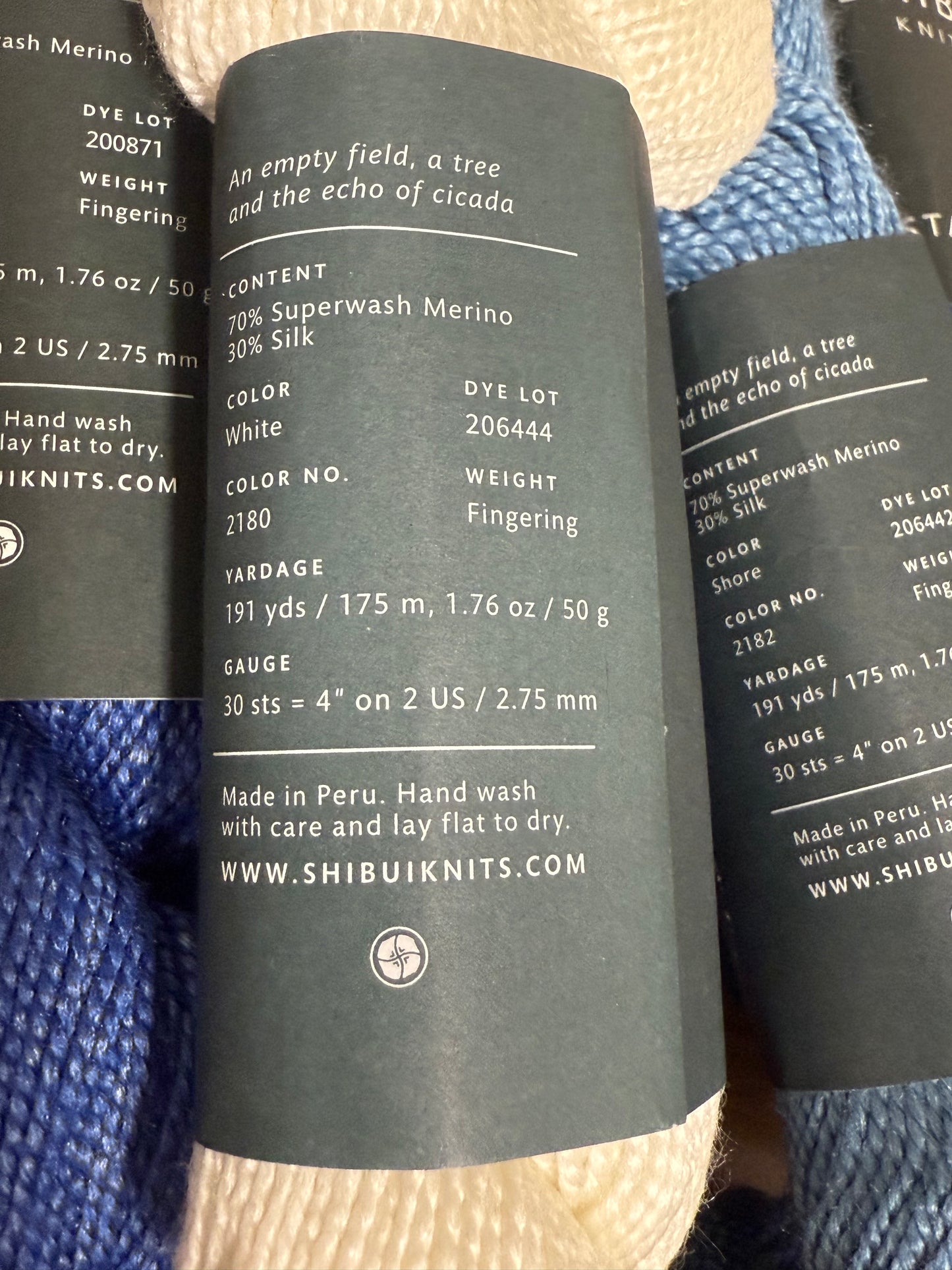 DESTASH: 7 skeins of Shibui Knits Staccato in colorway Blueprint (5x royal blue), Shore (1x light blue), and White (1x)